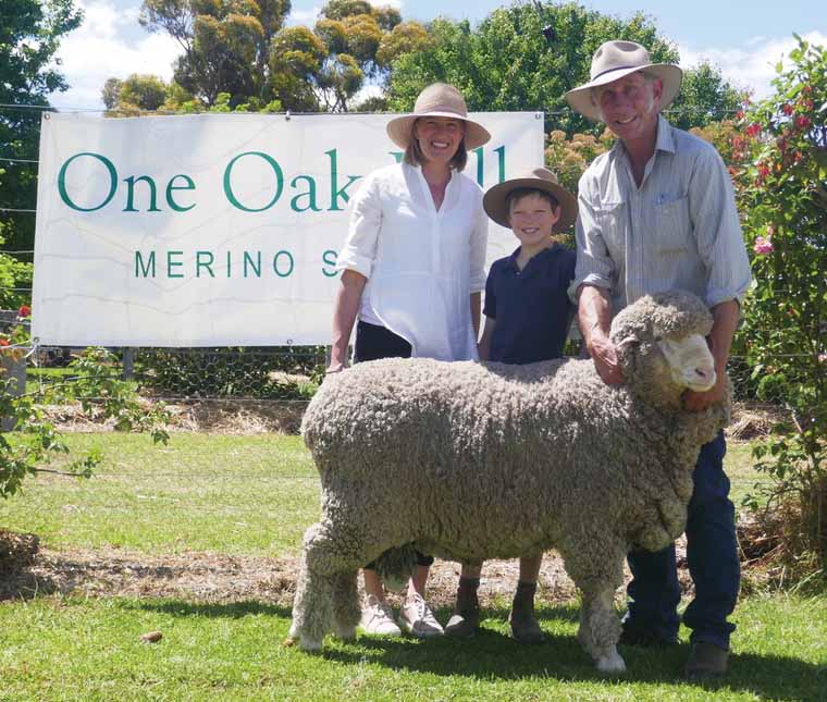 Natasha and Lachlan Wells with Michael Green, "Boudjah", holding the 2018 on-property auction top priced ram, purchased for $6000